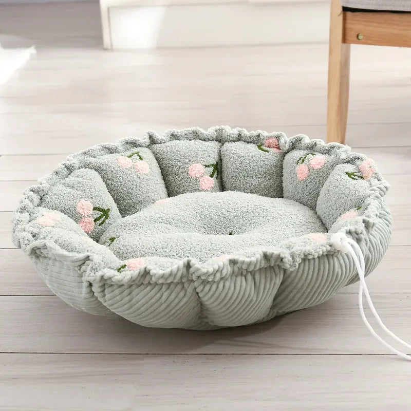 Rundes, graues Hundebett mit Blumenmuster, weiches Material, ideal für kleine Haustiere.