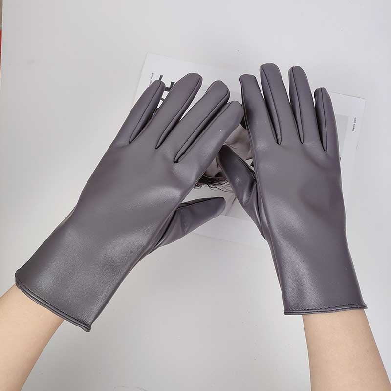 Graue Lederhandschuhe für Damen, elegant und stilvoll, ideal für Herbst und Winter. Hochwertiges Material, perfekte Passform, modisches Accessoire.