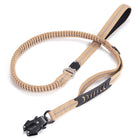 Beige Hundeleine aus Nylon mit elastischem Bungee, robustem Metallclip, ideal für Outdoor-Aktivitäten.