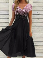 Elegantes schwarzes Kleid mit floraler Spitze, V-Ausschnitt und fließendem Rock. Perfekt für Abendveranstaltungen und besondere Anlässe.
