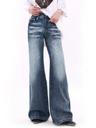 Weite Damen-Jeans mit hoher Taille, Vintage-Waschung und modischen Distressed-Details. Perfekt für trendige Streetwear-Looks.