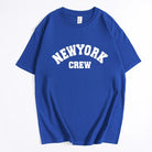Blaues T-Shirt mit "New York Crew" Aufdruck, lässiger Stil, 100% Baumwolle, ideal für Streetwear und Freizeitmode. Perfekt für urbane Outfits.