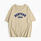 Beiges T-Shirt mit "New York Crew" Aufdruck, lässiger Stil, Unisex, ideal für Streetwear, Baumwolle, modisch, bequem, hochwertig.