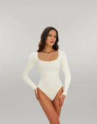 Damen-Body in Weiß, langärmelig, elegantes Design, ideal für Mode, Tanz oder Freizeit. Hochwertige Materialien, figurbetont und stilvoll.