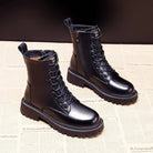 Schwarze Lederstiefel mit Schnürung und Reißverschluss, robuste Sohle, modisch und langlebig, ideal für Herbst- und Wintermode.