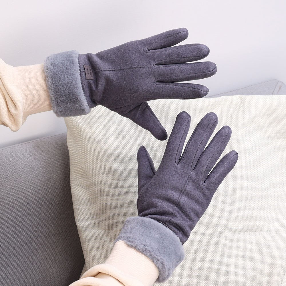 Elegante graue Handschuhe mit weichem Futter, ideal für kalte Wintertage. Perfekt für stilvolle Wärme und Komfort. Hochwertige Winteraccessoires.