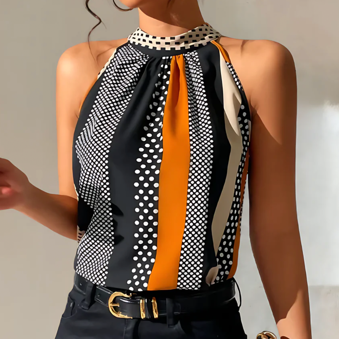 Damen-Top mit geometrischem Muster, ärmellos, schwarz-weiß-orange, elegantes Design, ideal für Sommermode und trendige Outfits.