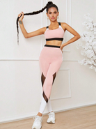 Damen-Sportbekleidung: Rosa und schwarze Leggings mit Mesh-Einsätzen, passendes Sport-BH-Top, ideal für Fitness, Yoga und aktive Freizeit.