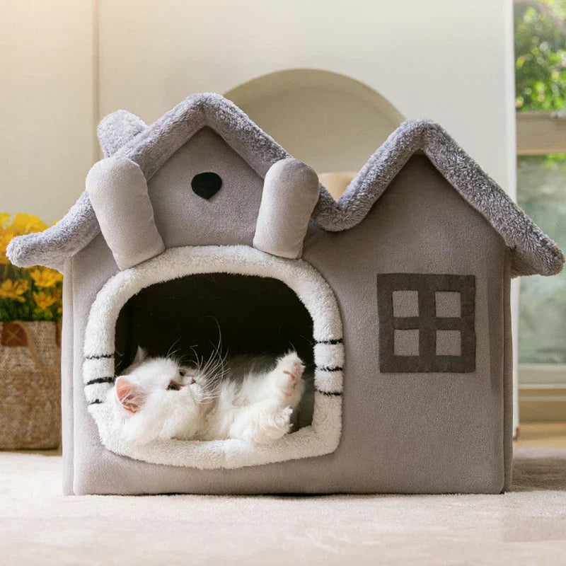 Katzenhaus aus Plüsch, grau, mit Fenstern, gemütlich, für Katzen zum Schlafen und Spielen.