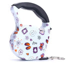 Bunte Hundeleine mit Blumen- und Schmetterlingsmuster, ausziehbar, ergonomischer Griff.
