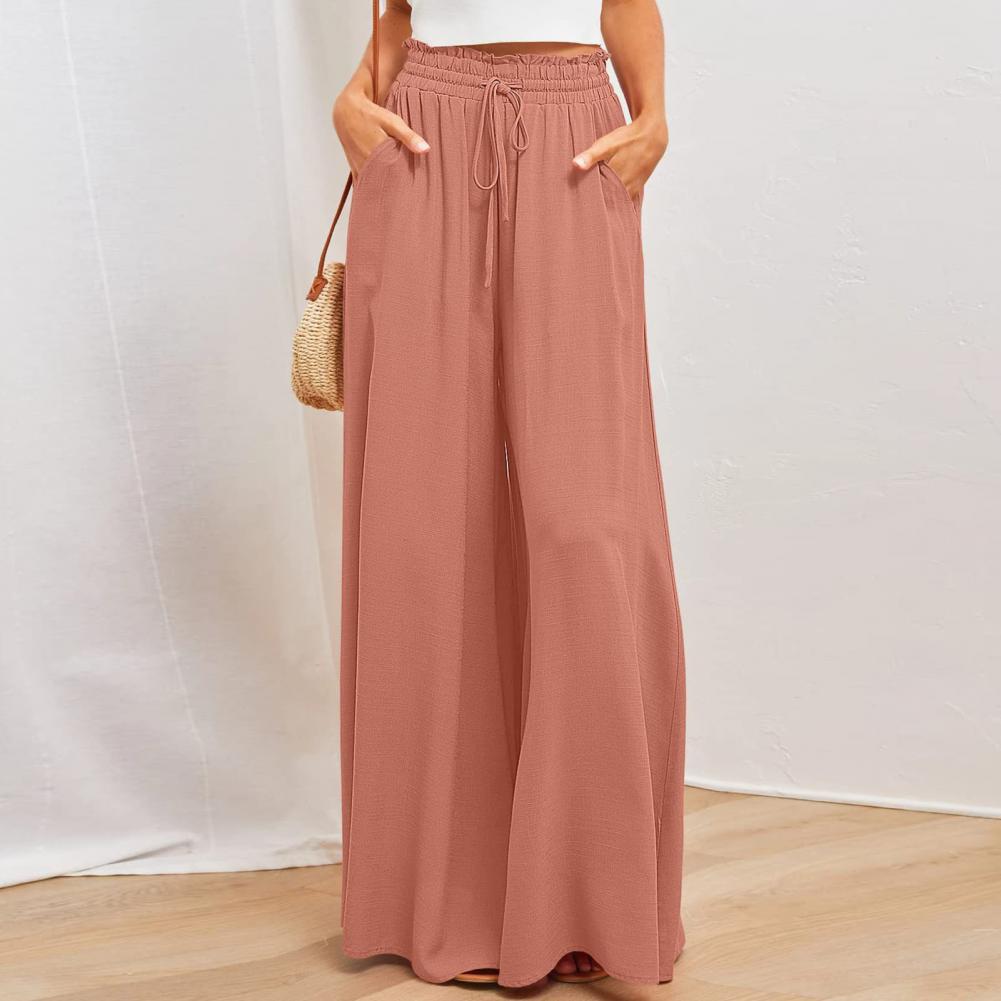 Damenhose in Rosa, weit geschnitten, mit elastischem Bund und Kordelzug. Perfekt für Sommermode, lässiger Stil, bequem und stilvoll.