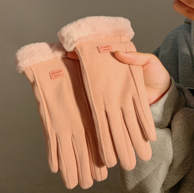 Damenhandschuhe aus rosa Fleece mit Kunstfellbesatz, warm und stilvoll, ideal für Wintermode. Perfekt für kalte Tage und elegantes Outfit.