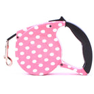 Rosa Hundeleine mit weißen Punkten, ausziehbar, ergonomischer Griff, für kleine Hunde.