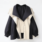 Damenjacke mit Kontrastdesign, schwarz-beige, modischer Oversize-Look, Reißverschluss, Herbstmode, stilvolle Oberbekleidung für Frauen.
