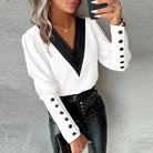 Elegante Damenbluse mit langen Ärmeln, V-Ausschnitt und Knopfleiste. Perfekt für Frühling und Herbst. Modisches Design, ideal für Casual-Looks.
