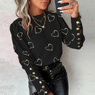Elegante Damenbluse mit Herzmuster, langen Ärmeln und goldenen Knöpfen. Perfekt für Frühling und Herbst. Modische, lässige Damenmode.