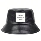 Unisex PU-Leder Fischerhut, schwarz, mit N°86 Brooklyn Label. Modischer Outdoor-Sonnenhut, ideal für Freizeit und Schutz vor Sonne.