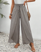 Damenhose mit weitem Bein, geometrischem Muster und elastischem Bund. Perfekt für Sommermode, lässiger Stil, ideal für Strand oder Freizeit.
