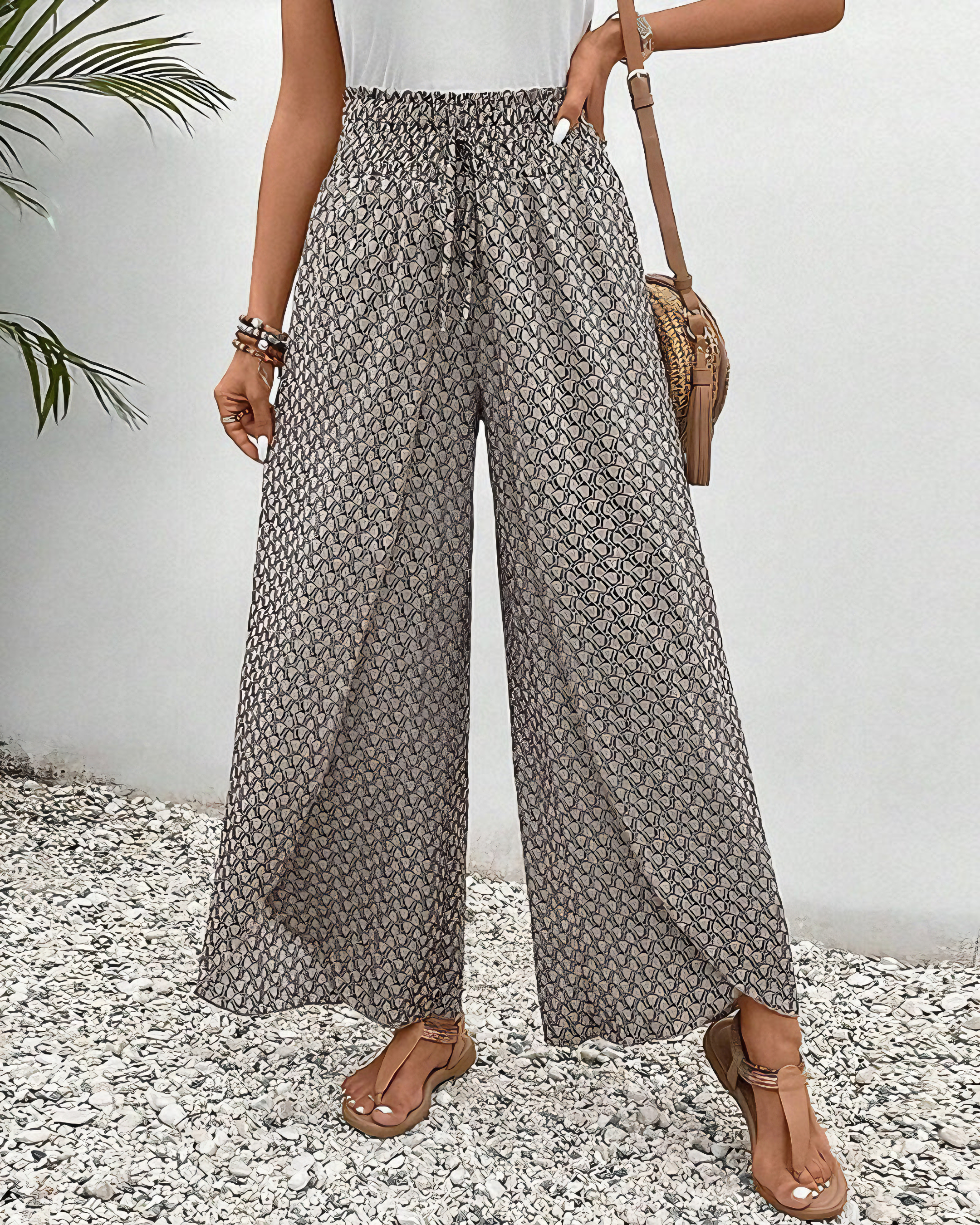 Damenhose mit weitem Bein, geometrischem Muster und elastischem Bund. Perfekt für Sommermode, lässiger Stil, ideal für Strand oder Freizeit.
