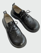 Schwarze Brogue-Oxford-Schuhe mit breiter Zehenbox, elegantes Design, ideal für Komfort und Stil, hochwertige Lederschuhe für Herren.