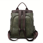 Grüner Lederrucksack mit braunen Trägern, stilvolles Design, ideal für Damen, geräumig, modisch, hochwertig, perfekt für Alltag und Reisen.