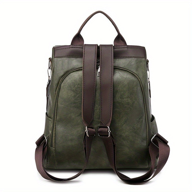 Grüner Leder-Rucksack mit braunen Trägern, stilvolles Design, ideal für Damen, geräumig, langlebig, perfekt für Alltag und Reisen.