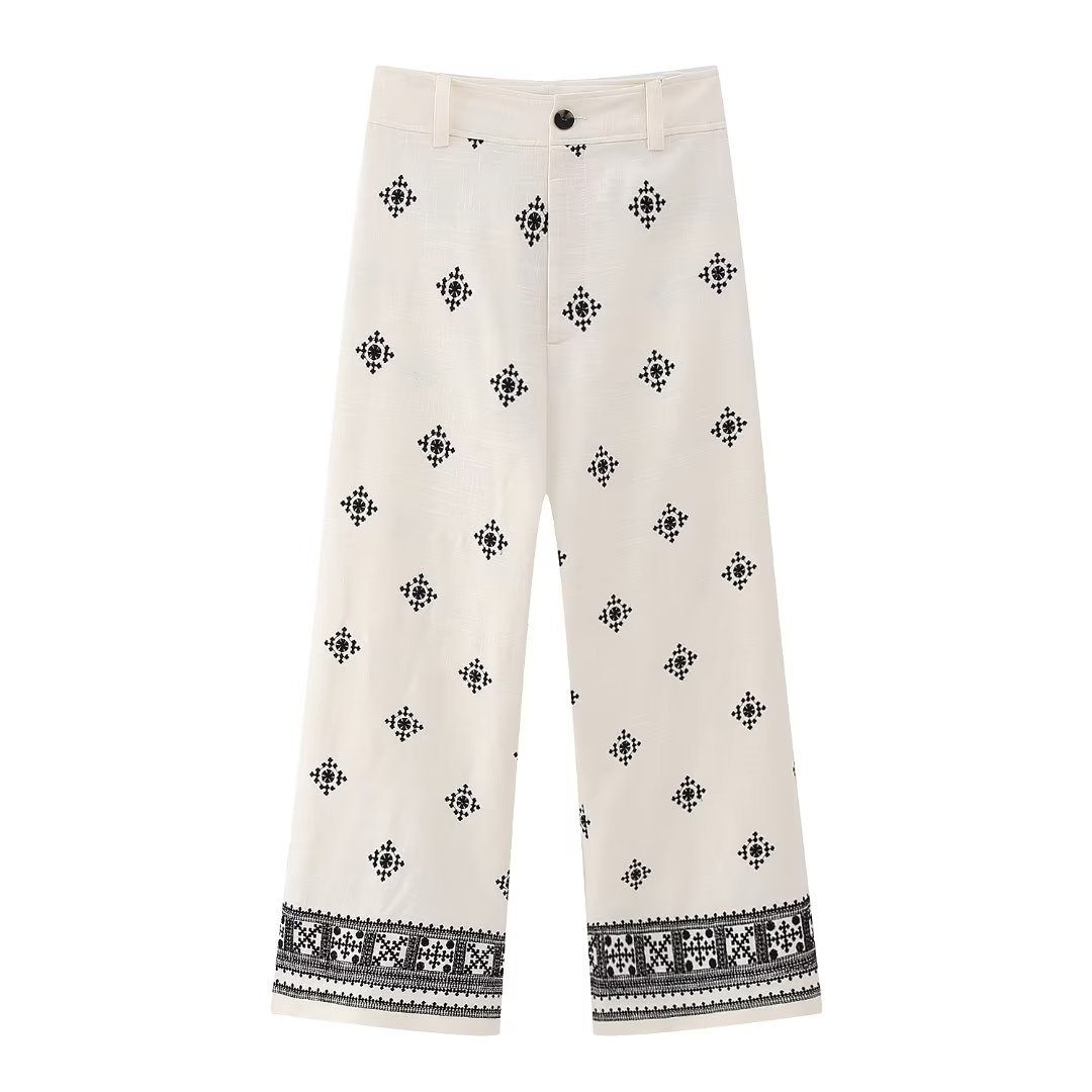 Weiße Damenhose mit schwarzem Ethno-Muster, weites Bein, Baumwolle, modisch, bequem, ideal für Sommer, Freizeitkleidung, Boho-Stil.