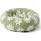 Grünes Hundebett mit weißen Blumen, rund, flauschig, gemütlich, Haustierbett für kleine Hunde.