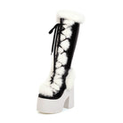 Schwarzer Plateau-Stiefel mit weißem Kunstfell und Schnürung. Modischer Damenstiefel, ideal für Winteroutfits und trendige Looks.