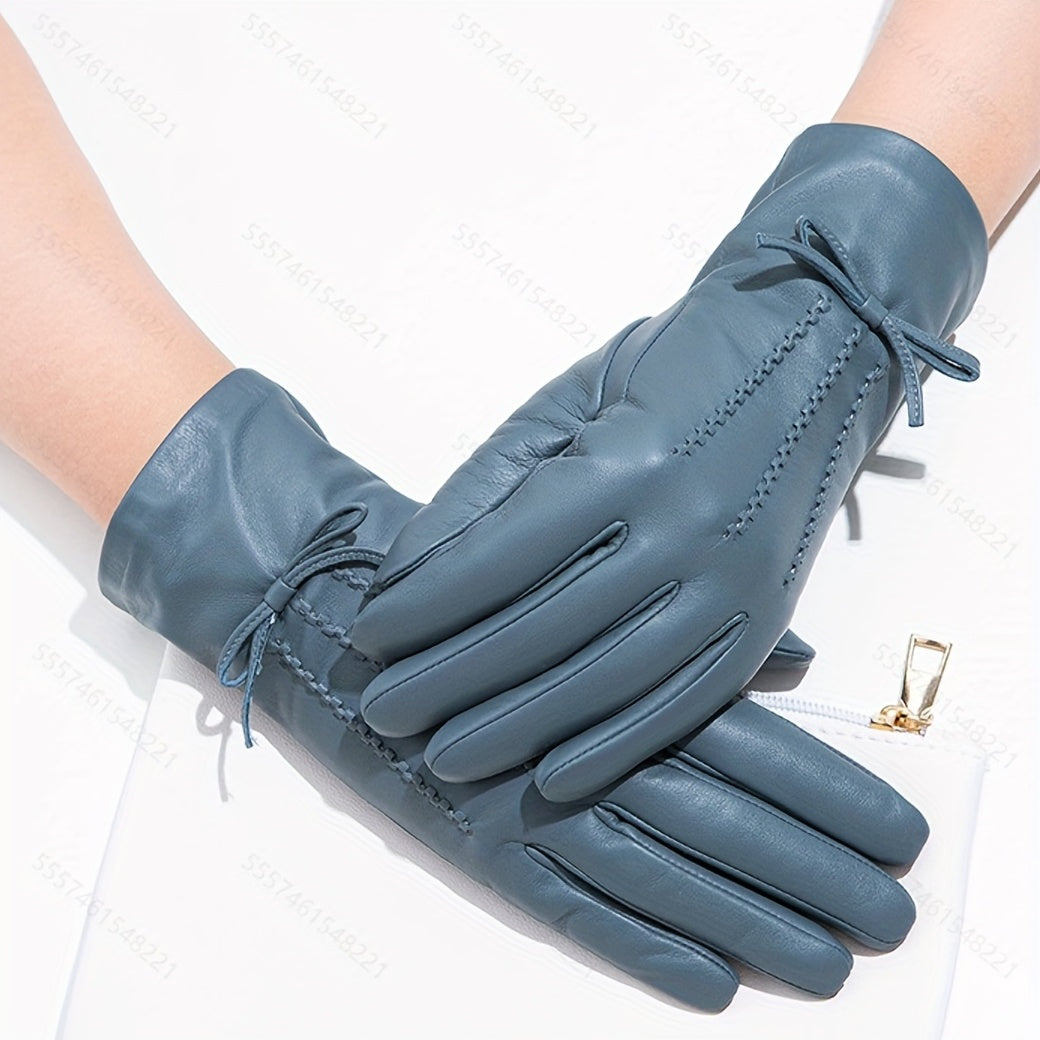 Blaue Lederhandschuhe mit Ziernähten und Schleifen, elegante Damenmode Accessoire.