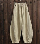 Weite Leinenhosen für Mädchen in Übergröße, beige, elastischer Bund, lässiger Stil. Perfekt für Komfort und modische Freizeitkleidung.