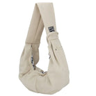 Beige Hundetragetasche aus Baumwolle, ergonomisch, mit Karomuster-Innenfutter. Ideal für kleine Hunde, stilvoll und praktisch für unterwegs.
