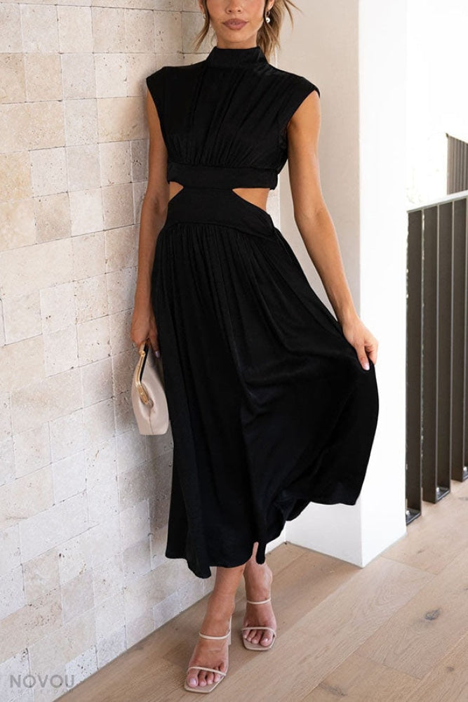 Elegantes schwarzes Kleid mit Cut-Outs, ärmellos, knielang. Perfekt für Abendmode und Partys. Modetrend 2023, stilvoll und bequem.
