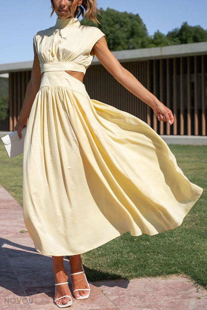 Elegantes gelbes Kleid mit Cut-Outs, ideal für Sommermode. Perfekt für Damen, die stilvolle und bequeme Kleidung suchen.