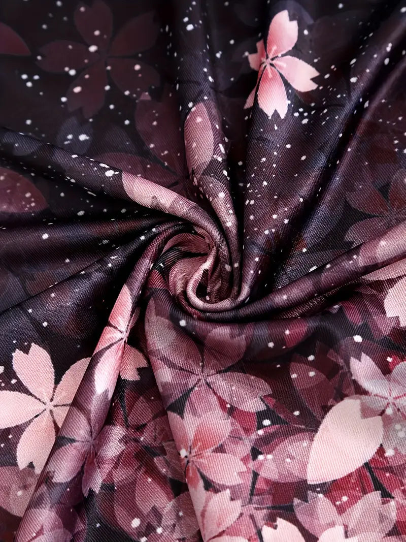 Rosa Kirschblütenmuster auf schwarzem Stoff, ideal für Frühlingsmode und Dekoration.