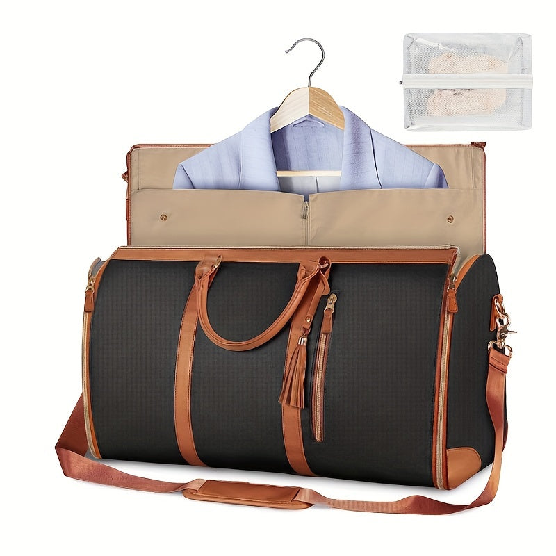 Schwarze Reisetasche mit braunen Lederakzenten, integriertem Kleidersack und abnehmbarem Schultergurt. Perfekt für stilvolles Reisen und Business.