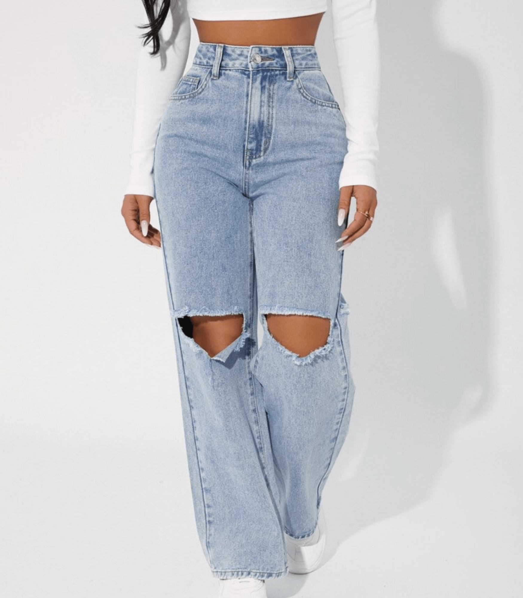 Damen-Jeans mit hoher Taille und großen Löchern, modischer Denim-Look, ideal für trendige Outfits. Perfekt für lässige und stilvolle Anlässe.