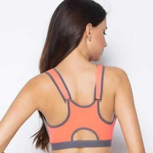Doppelter Sport-BH mit Reißverschluss, ideal für Fitness und Yoga. Atmungsaktiv, stützend, in leuchtendem Orange. Perfekt für aktive Frauen.