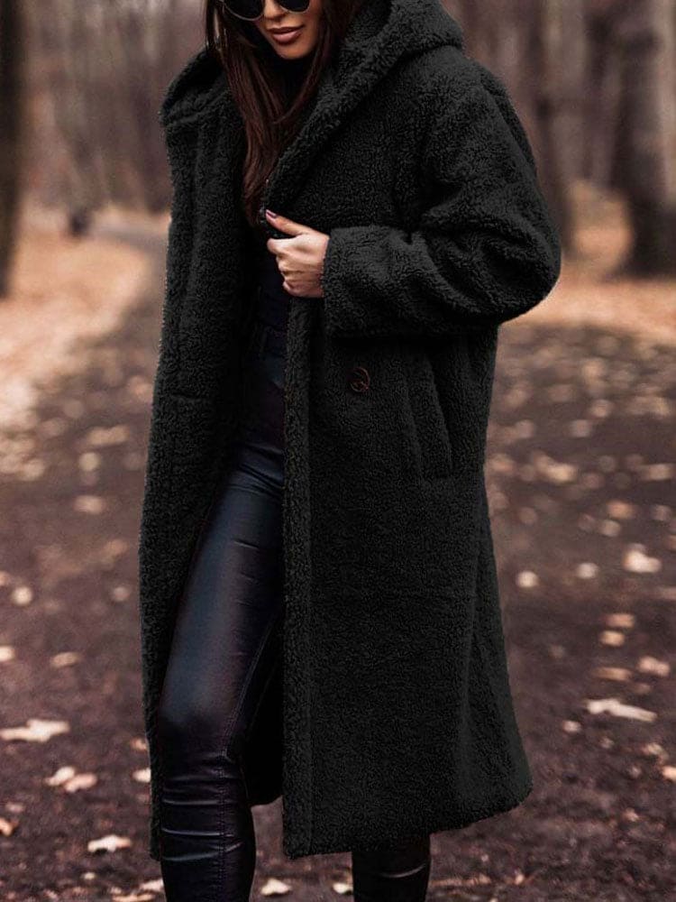 Damen Wintermantel aus schwarzem Teddyfell, modisch und warm, ideal für kalte Tage. Perfekt für stilvolle Herbst- und Winteroutfits.