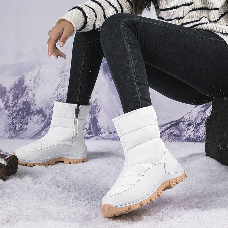 Damen-Winterstiefel, weiß, wasserdicht, mit rutschfester Sohle. Ideal für Schnee und Outdoor-Aktivitäten. Modisch und funktional.
