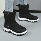 Schwarze Winterstiefel mit dicker Sohle und Reißverschluss, ideal für kaltes Wetter. Modische, warme Schuhe für Damen und Herren.