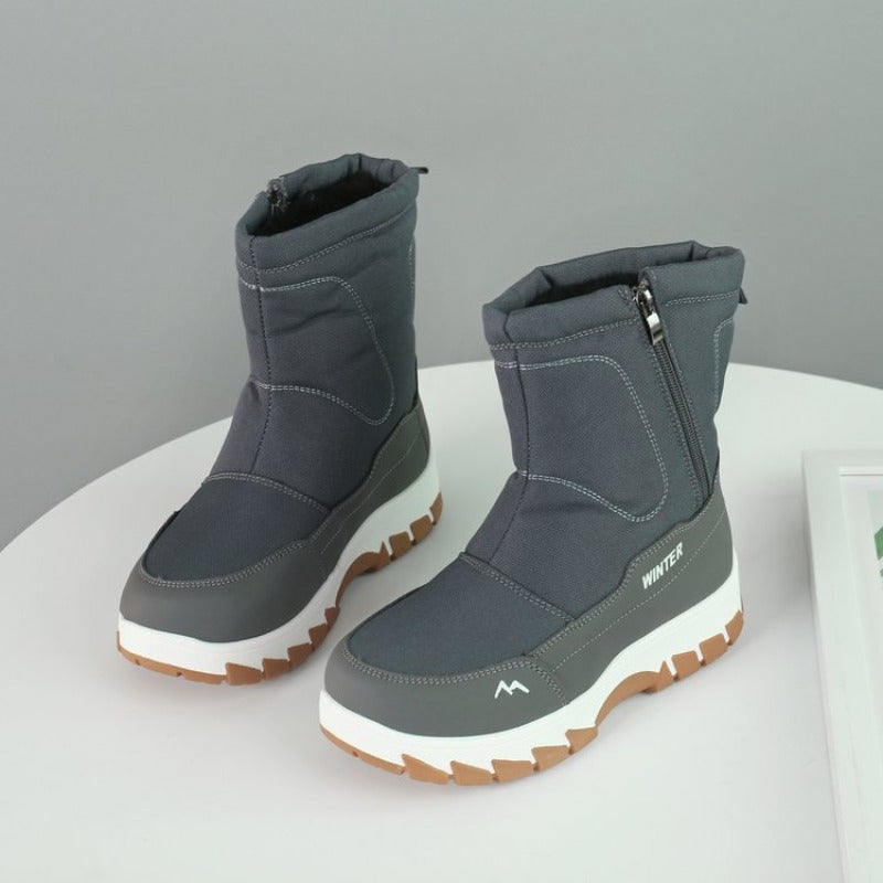 Graue Winterstiefel mit Reißverschluss, rutschfester Sohle und modernem Design. Perfekt für kalte Tage. Hochwertige, warme Winterstiefel.