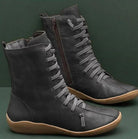 Damenstiefel aus Leder, schwarz, mit Schnürung und Reißverschluss. Bequeme, modische Schuhe für Herbst und Winter. Ideal für Freizeit und Alltag.