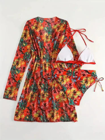 Bunter Strandkleid-Set mit tropischem Blumenmuster, bestehend aus Bikini und passendem Kleid. Perfekt für Sommer, Strandmode, Urlaub.