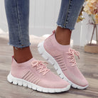 Damen Sneaker in Rosa, atmungsaktiv und bequem, ideal für Freizeit und Sport. Modische Strickoptik, rutschfeste Sohle, trendige Wahl.