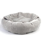 Graues, rundes Hundebett aus weichem Stoff, gemütlich und waschbar, ideal für Haustiere.