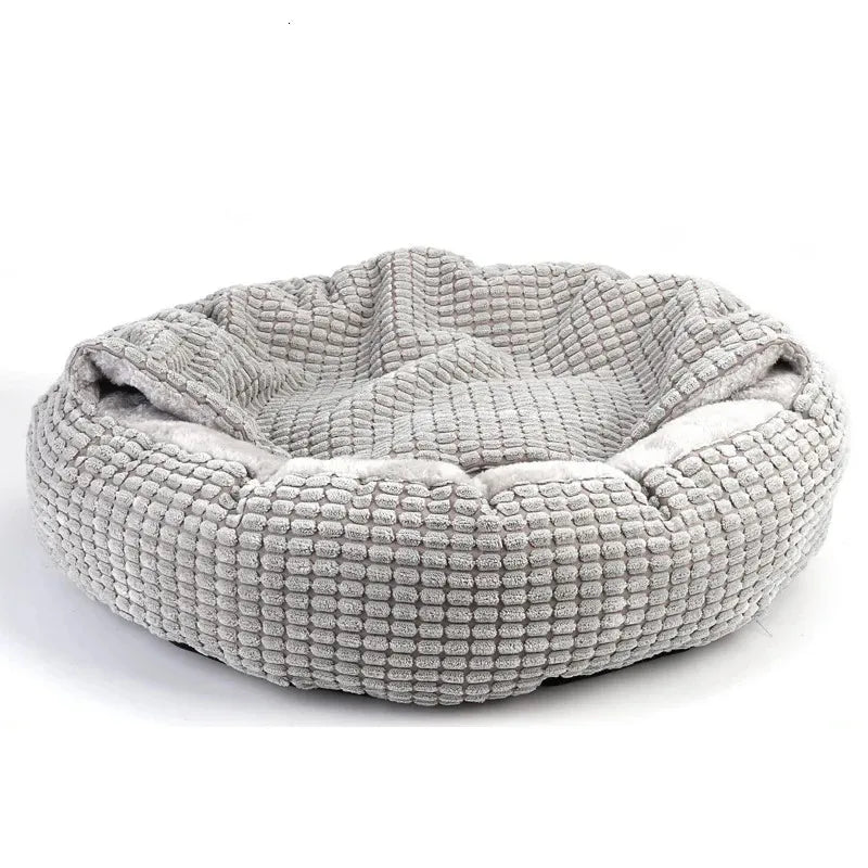 Graues, rundes Hundebett aus weichem Stoff, gemütlich und waschbar, ideal für Haustiere.