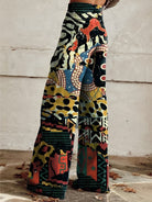Bunte, weite Damenhose mit abstraktem Muster, ideal für modische Herbst-Outfits. Perfekt für Boho- und Vintage-Looks. Hochwertige Stoffqualität.