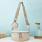 Beige Umhängetasche mit geometrischem Riemen, runde Tasche, Damenmode, Accessoire, modern.