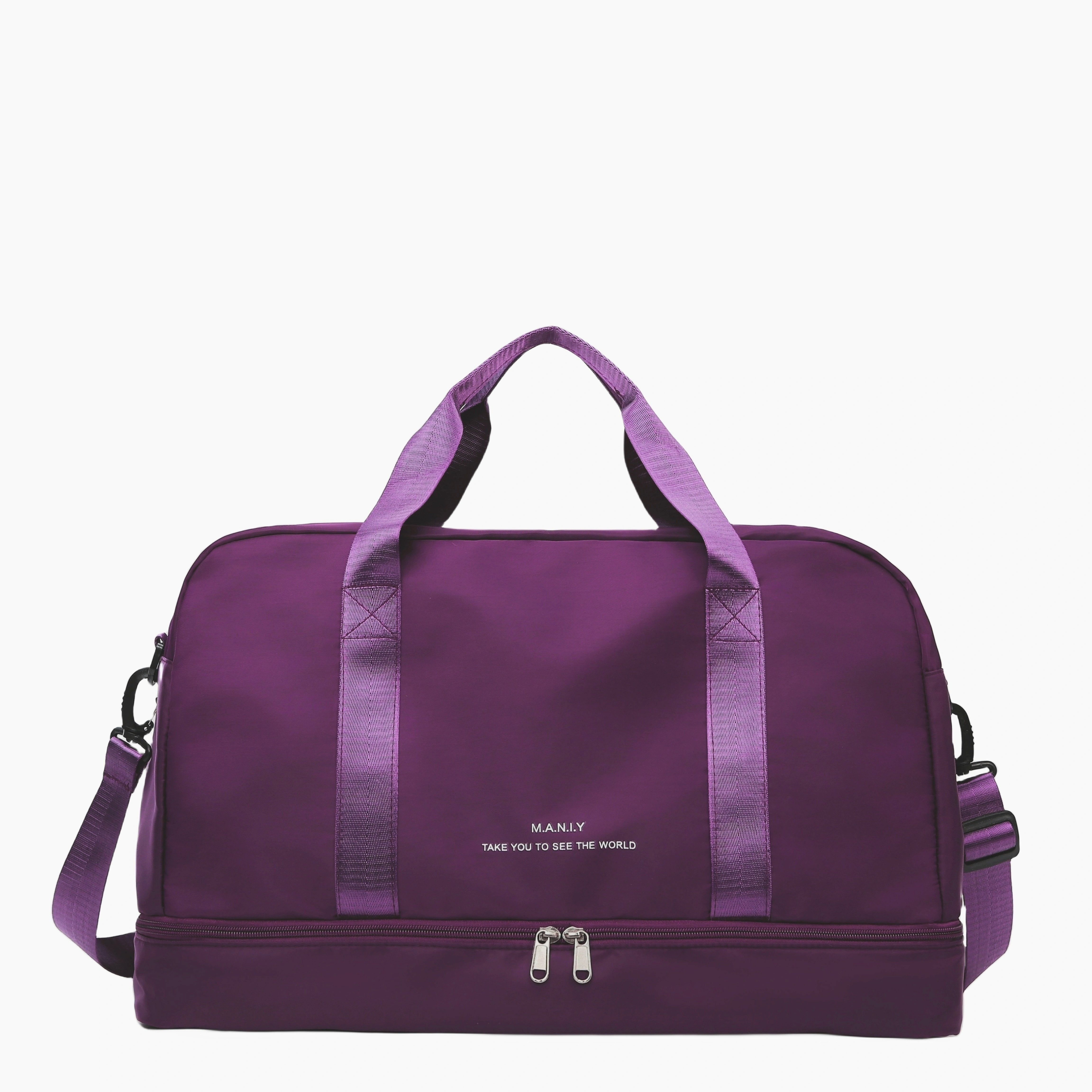 Lila Reisetasche mit Tragegriffen und Schultergurt, ideal für Reisen. Robustes Design, geräumig, mit Reißverschluss. Perfekt für Wochenendausflüge.